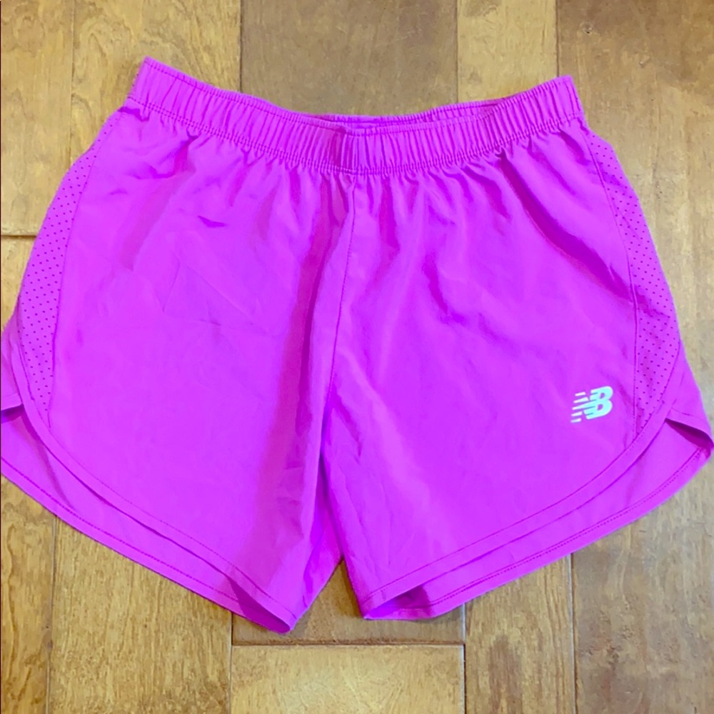 Bright pink New Balance workout shorts